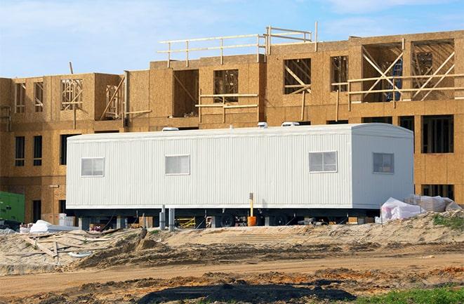 construction workers discussing plans in a rental office in Clawson, MI